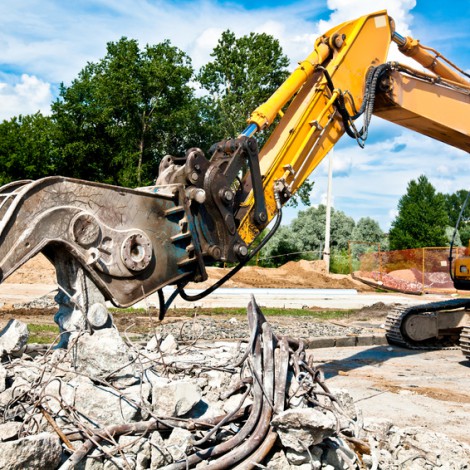 Concrete Crusher demolishing reinforced concrete structures